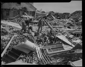 People going through wreckage left by tornado