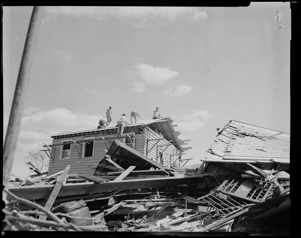 Construction Workers Repairing Roof Of Home Damaged By Tornado ...