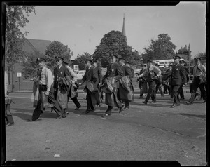 Uniformed police officers crossing street