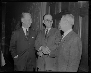 Pleased to meet you says William Hellman, (center) new pres. of Kennedy's Clothing Co. to John C. Nicodemus, (left) former vice president and to H. Donald Nostram (right) treasurer of co.