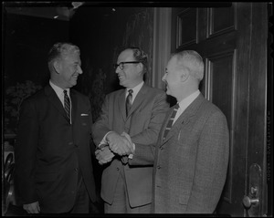 Pleased to meet you says William Hellman, (center) new pres. of Kennedy's Clothing Co. to John C. Nicodemus, (left) former vice president and to H. Donald Nostram (right) treasurer of co.