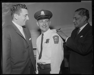 Getting an autograph from Indian ambassador B. K. Nehru is police officer Roy Covell of Readville who lends his back for the writing