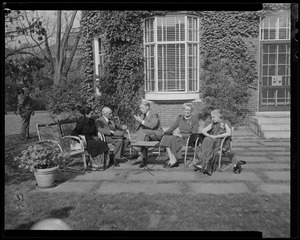 Indira Gandhi, Jawaharlal Nehru, James B. Conant, Mrs. Conant, and Vijaya Lakshmi Pandit seated outdoors