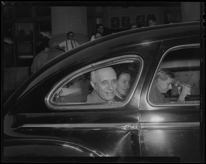 Jawaharlal Nehru in backseat of vehicle with two others