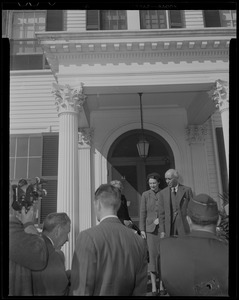 Jawaharlal Nehru and Margaret Clapp at entrance of building with others in foreground