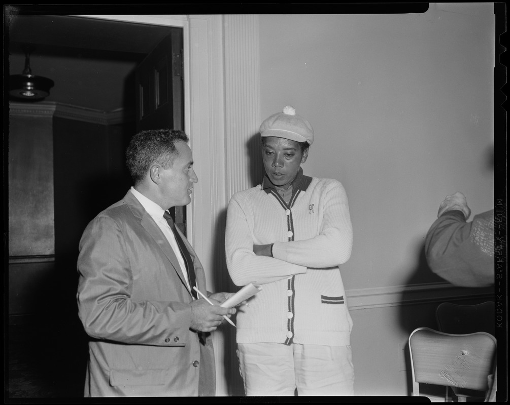 That Gibson girl - Althea Gibson and Record sports reporter Milton Greenglass during a press conference at the Hotel Statler. Althea is competing in a golf tournament at Ponkapoag Golf Course in Canton