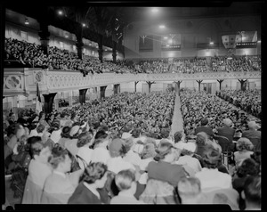 Audience seated at revival service with Billy Graham in Mechanics Hall, as seen from the stage