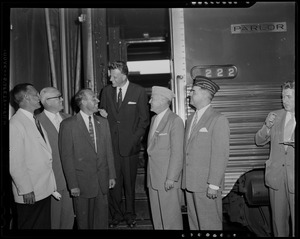 Billy Graham chats with city greeter Jack Brown (next to Graham on left), VFW National Commander Merton B. Tice (next to Graham on right), and Rear Adm. Harley Cope at South Station