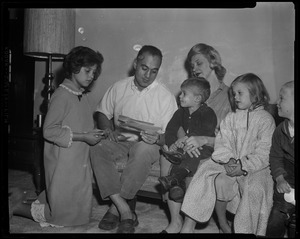 Lt. Governor-elect Francis X. Bellotti, wife, Kathy, 11, Tommy, 2, and Rita, 5. Congratulatory telegrams read by victorious Democrat in his Quincy home as his admiring family looks on