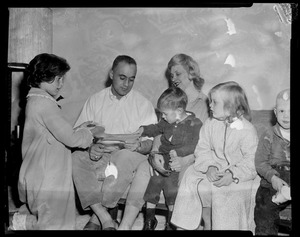 Lt. Governor-elect Francis X. Bellotti, wife, Kathy, 11, Tommy, 2, and Rita, 5. Congratulatory telegrams read by victorious Democrat in his Quincy home as his admiring family looks on