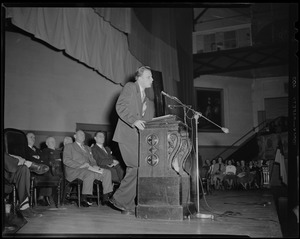 Billy Graham at podium, addressing the crowd