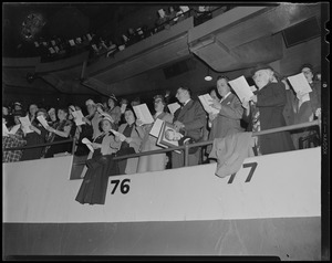 Sections 76 and 77 standing and singing during service with Billy Graham at Boston Garden