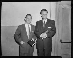 Billy Graham standing next to another man