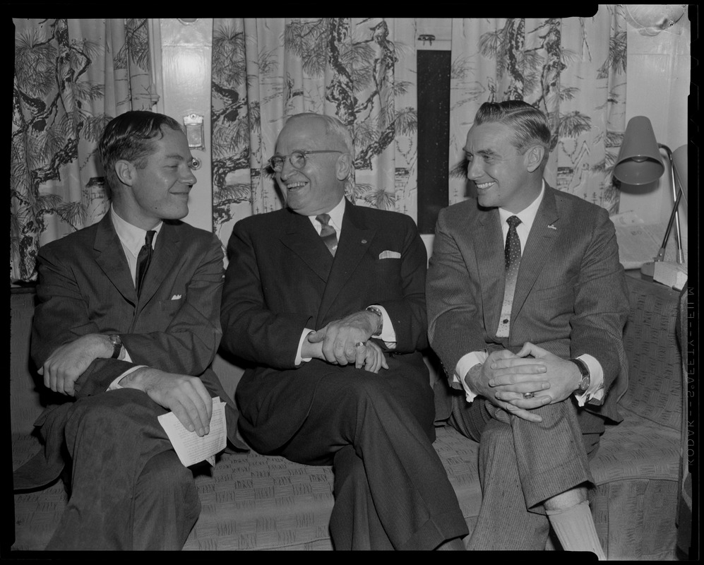 Harry Truman, center, seated on couch and smiling with Edward McCormack ...