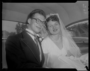 Newlyweds Stefan Habsburg-Lothringen and Jerrine Soper in the back of a vehicle