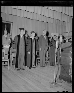 Vice President Richard Nixon, wearing cap and gown, with Martin Lydon, President of the Lowell Tech. Institute and Gov. Chris Herter -- shortly before Nixon was presented with honorary degree from the school