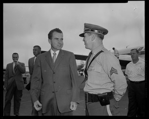 Vice President Richard Nixon talking with police sergeant at Logan Airport