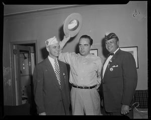 Tennessee Governor Frank Clement waving hat, with two men on either side of him