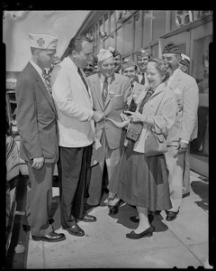 Tennessee Governor Frank Clement greets woman with camera while VFW Commander Merton Tice and others look on