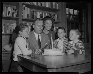Gowdy to announce Series -- given a surprise party by members of his family, Curt Gowdy, "The Voice of the Red Sox" is shown as he prepares to blow out single candle on cake
