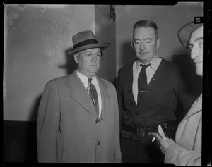 Three men standing together