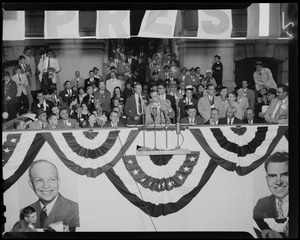 Vice President Richard Nixon speaking at podium with crowd behind him