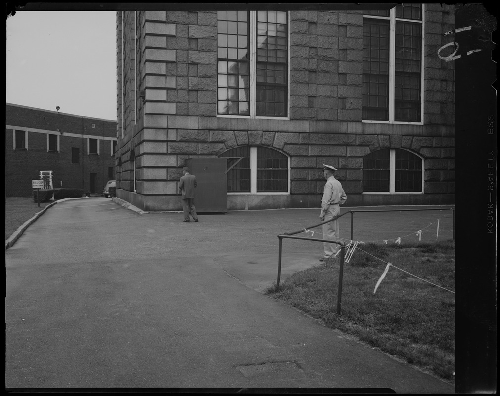 Two men outside of Charles Street Jail building