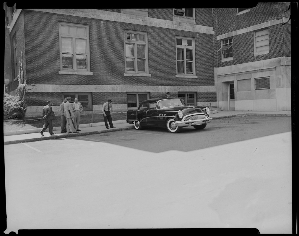 People standing near car