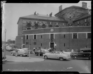 Crowds and cars outside of Charles Street Jail