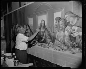 Gaston Goyette of Bedford, world-famous ecclesiastical artist, puts finishing touches to his interpretation of The Last Supper...a mural which will be part of the decorative scheme of St. Peter's Church, Worcester. It measures 24 feet in length and took five months to complete