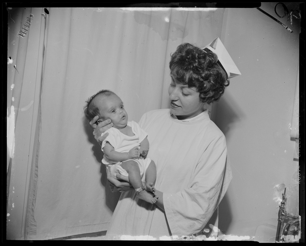 Nurse holding up abandoned baby