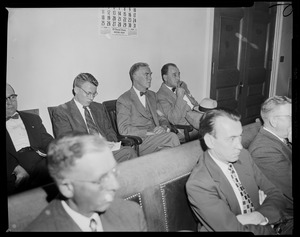 Gov. Herter seated in rear of room at Governor's Conference