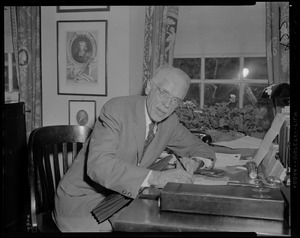 Dr. Paul Dudley White, back in his office after a trip to Africa, where he visited the famed Dr. Schweitzer