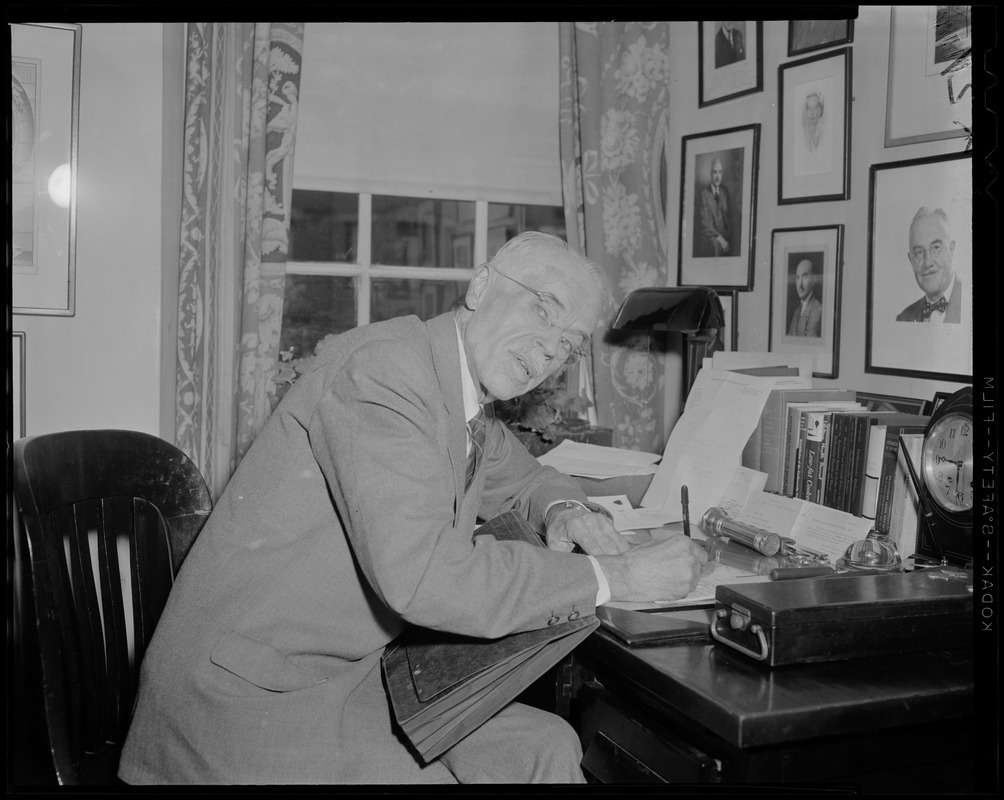 Dr. Paul Dudley White, back in his office after a trip to Africa, where