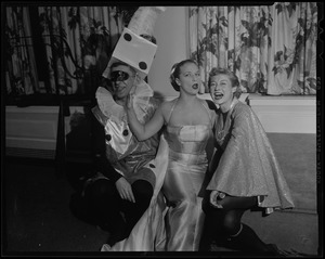 Hollywood TV-film star Denise Darcel, center, reigned as Queen of the Ball at the second Beaux Arts Ball sponsored by friends of School of Creative Arts of Brandeis University, at Hotel Somerset. Sumner Gerstein, left, and Hortense Lappin, co-chairmen, flank the star