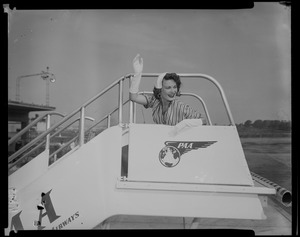 Joan Daly, Somerville, Miss Massachusetts, '53, leaves airport for Long Beach, Cal., to compete in the Miss Universe contest tomorrow