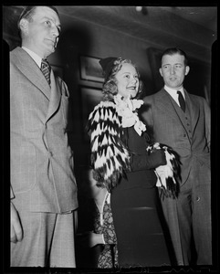 Sonja Henie at party with two men