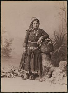 Studio portrait of woman in traditional Greek dress