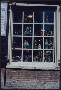 Various objects displayed in shop window, Ebenezer Hancock house, Boston