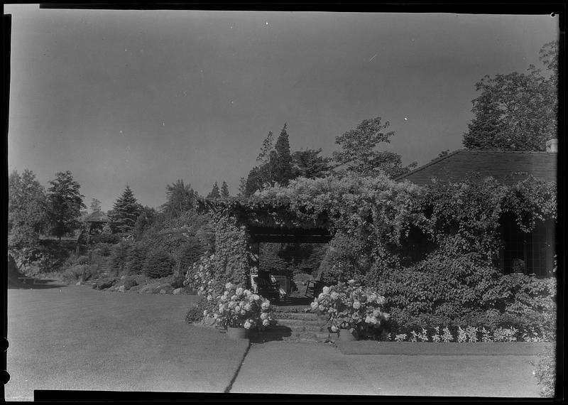 Porch of "sport house" and distant rock garden at Mr. H. E. Gale's