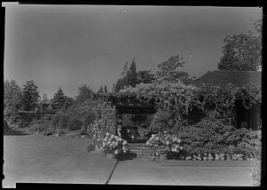 Porch of "sport house" and distant rock garden at Mr. H. E. Gale's