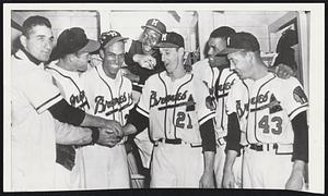 Braves Hero Two Days Running was Bill Bruton (third from left) who homered to give the Braves a 3-2 win over the Cards after helping beat the Reds Monday. Congrats are offered by (left to right) Johnny Antonelli, Ebba St. Claire, Bruton, Luis Marquez, Warren Spahn, George Crowe and Don Liddle.