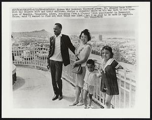 Honolulu: Korean War turncoat Clarence Adams, 37, relaxes here 6/29 with his Chinese wife and their children, during a stopover while on his way back to his hometown of Memphis, Tennessee. Adams, returning from a 13-year "rich experience" in Communist China, said "I wanted to find out what China was like...but I am glad to be back in America.