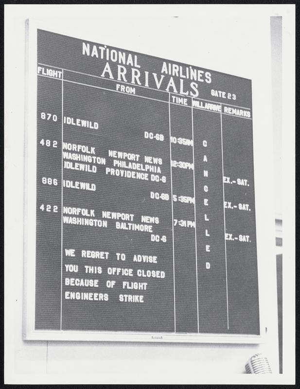 Boston Airport - National Airlines Arrivals board with a notice, "We regret to advise you this office is closed because of flight engineers strike"