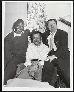 Left to right. Johnny Saxton (welterweight champion) Benny Stamper (trainer) and manager Frank Palermo