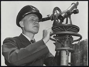 Weather-Instruments- Doyle Tandy, American Airlines meteorologist observing an ascending balloon thru a theodolite