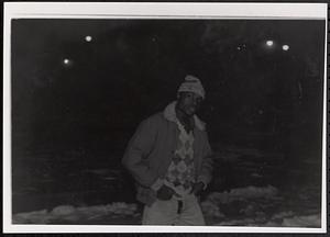 Young man posing in a jacket and winter hat