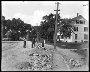 H. W. Sheldon, C. T. Sheldon and C. F. Manning surveying gutter on Talbot Avenue