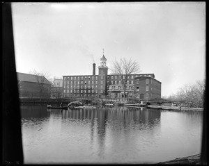 Front of mill from bolt. N.H. Hutchins in boat
