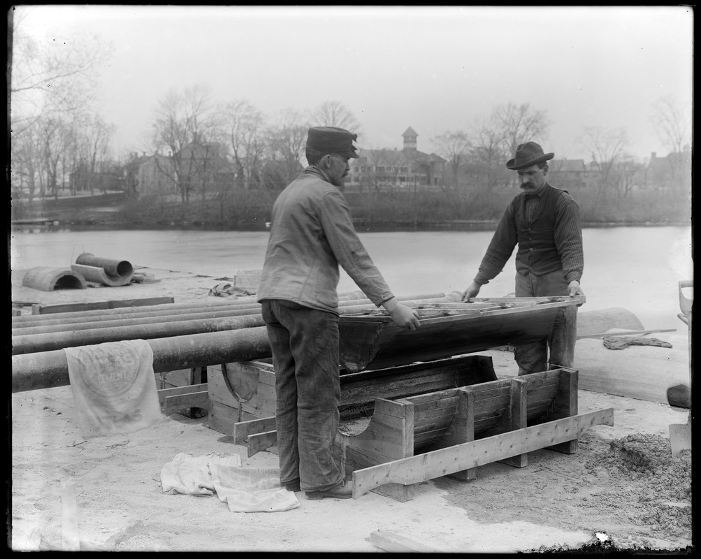 Cement covering for town water pipe over arches (making)